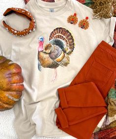 Introducing our "Turkey Graphic Shirt," a festive and versatile addition to your Thanksgiving wardrobe. You can choose from short sleeve, long sleeve, or sweatshirt options to suit your style and comfort preferences. This shirt is perfect for celebrating Thanksgiving with style and comfort.
Whether you're enjoying a delicious turkey dinner, spending time with loved ones, or simply want to showcase your Thanksgiving spirit, this shirt is the ideal choice. You can also easily dress it up with a ca Classic Turkey, Turkey Design, Turkey Dinner, Graphic Shirt, Polished Look, Graphic Shirts, Suits You, Your Style, First Love