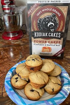 a plate full of cookies next to a box of kodia cakes