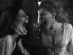 two women in costumes with their mouths open