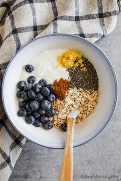 the ingredients to make blueberry oatmeal are in a bowl