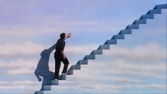 a man standing on top of a stair case