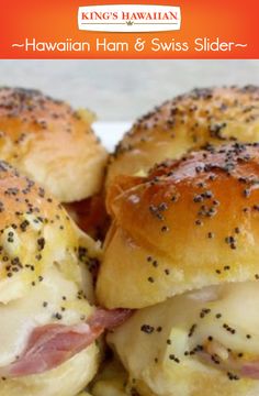 two ham and cheese sliders on a white plate with black pepper sprinkles