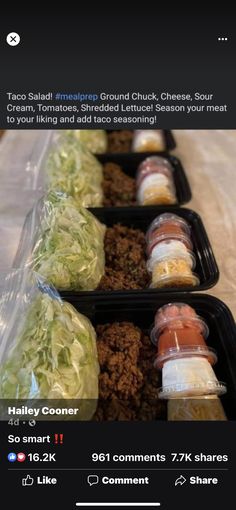 three plastic trays filled with food sitting on top of a table