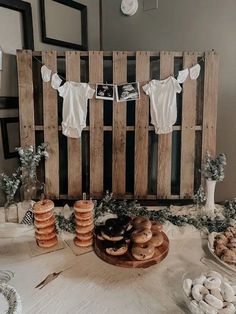 a table topped with lots of donuts and other desserts on top of it