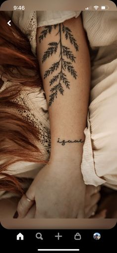 a woman's arm with a tattoo on it and the word love written in cursive writing