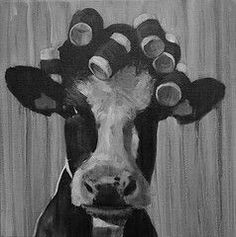 a black and white photo of a cow with circles on it's head