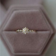 an engagement ring in a velvet box