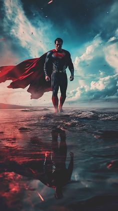 a man in a superman suit is standing on the water with his cape flying above him