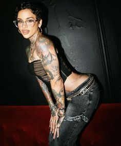 a woman with lots of tattoos on her body