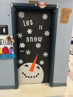 a classroom door decorated with snowmen and the words let it snow