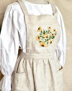 Every cook needs an apron This apron is designed for women as and special gift for your best friend, gift for mom, for sisters  ITEM DESCRIPTION ✔️ Classic linen apron, the one apron you will ever need in your kitchen or garden ✔️ Make from linen it will keep your clothes clean ✔️ unique and handmade  ✔️ We also design 2 pockets where you can keep little kitchen or gardening utensils on hand.  ✔️ Handmade 100% with hand-embroidered  ✔️Pattern: floral ✔️ Colour in the picture: Hunter green  Anoth Cottagecore Apron, Embroidery Aprons, Embroidered Apron, Cute Aprons, Gardening Outfit, Aprons Patterns, Little Kitchen, Womens Aprons, Apron Designs