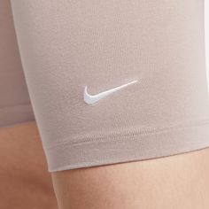 Style No. CZ8526-272 Color: Diffused Taupe/White Soft and stretchy fabric helps wick sweat away from your body to keep you feeling cool and dry. 61% cotton/33% polyester/6% spandex. Tight fit for a body hugging feel. Mid-rise waistband. Embroidered Swoosh logo. Nike Sportswear Essential Women's Mid-Rise Biker Shorts. Red Puffer, Women's Sportswear, Red Nike, Swoosh Logo, Nike Sports, Grey Leggings, Sportswear Women, Nike Shorts, Nike Outfits