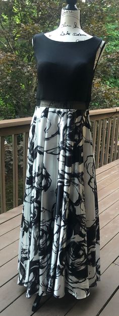 Formal Cocktail party?  This Jackie O Inspired evening maxi is perfect for an evening gathering at a club!  Fully lined bodice is black, great coverage and has a floral flouncy skirt.  Flattering illusion mesh around waist add intrigue. Flouncy Skirt, Formal Cocktail Party, Floral Cocktail Dress, Jackie O, Black And White Floral, Formal Wedding, Dress Clothes For Women, Cocktail Party, Bodice