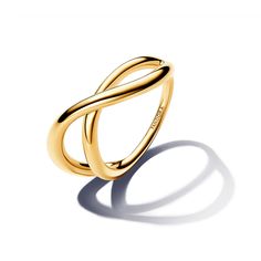 Bring dimension to your look when you wear the Organically Shaped Infinity Ring. This 14k gold-plated ring splits into two overlapping bands, connected at the back. Both bands have a with a slight wave and varied width for an undulating, organic look. Embodying the beauty found in nature's organic shapes, this ring will add an architectural element to your look. Pair it with warm-toned styles for monochromatic minimalism or use it as the foundation for your next maximalist stack. Infinity Rings, Pandora Essence, Pandora Necklace, Paper Ring, Bracelet Pandora, Gold Armband, Pandora Rings, Infinity Ring, Charm Rings