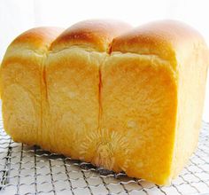 a loaf of bread sitting on top of a cooling rack