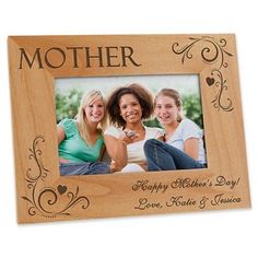 a wooden frame with the words, mother and two children in it on a table