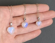 "Moonstone is \"the stone of new beginnings\". These blue flash moonstone puffy hearts are the perfect crystal to help balance the female energy and the female reproductive system.  Choose your crystal option and choice of setting at checkout. Size Option: Approximately Option 1 - 6 about 10mm - 13mm Option 7 - 12 about 11mm - 12mm Option 13 - 56 about 10mm - 11mm Option 57- 58 about 9mm - 10mm If you would like just the crystal, please click on the listing below. https://www.etsy.com/ca/listing/1071812285/mini-blue-moonstone-heart-rainbow?ref=shop_home_active_27&crt=1 Please note, these are natural crystals with lots of surface marks or chips or pits which adds to the character of the crystal. We do our best to capture them in the photo, but they may not show up properly. Please contact u White Heart-shaped Moonstone Jewelry, White Heart-shaped Crystal Necklace Gift, White Heart-shaped Crystal Necklace For Gift, Female Energy, Female Reproductive System, Reproductive System, Blue Moonstone, Solar Plexus Chakra, Puffy Heart