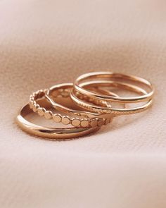 Don't know where to begin with our large selection of rings? We selected 5 dainty 14K gold filled rings to start your rings collection. Our starter set is the first step to building your jewelry collection. Set of 5 Rings 14K Gold Filled Size 4-10 Please note there are slight color variations or an appearance of a seam where the joints of the ring has been soldered. Due to their handmade nature, keep in mind that solder marks are visible and normal to have. If you would like. different sizes for Stacking Rings Gold, Dainty Rings, Layered Rings, Dainty Gold Rings, Rings Collection, Stacking Ring Set, Casual Jewelry, Jewels Rings, Golden Ring