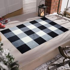 a black and white rug sitting on top of a step