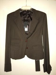 This Blazer by Antos Lombardini has some great design features. Its the darkest chocolate brown (near black), fully lined. The center panel of back is slightly SHORTER than the side-back panels and front! There is a reversible belt that can be worn in back or front. Jacket had some weight to it on the hanger. Please see pics. Size 46. Waist is about 14 inches measured flat across front, so double that. Sleeves are about 25 inches long from top of shoulder. Front is about 22 inches long from top Designer Brown Blazer For Office, Designer Brown Office Blazer, Designer Long-sleeved Brown Blazer, Designer Brown Long Sleeve Blazer, Dark Chocolate Brown, Reversible Belt, Chocolate Brown, Design Features, Blazer Jacket