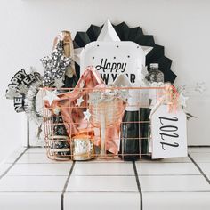 a metal basket filled with bottles and decorations