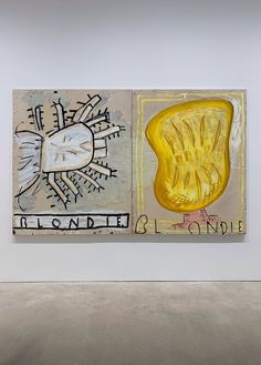 an abstract painting on display in a white room