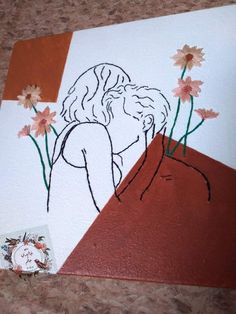 a drawing of two people kissing in front of flowers on a white and brown background