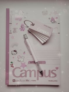 a clipboard with some writing on it and a pen laying next to it that says campus