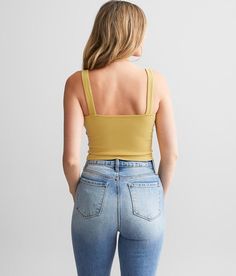 Free People Ribbed Brami Tank Top - Yellow M/L, Women's Goldendusk Cropped v-neck tank Bust measures 23 on size XS/S Body length 15 on size XS/S Model Info: Height: 5'10 1/2 | Bust: 34 1/2 | Waist: 25 1/2 | Hip: 35 1/2 | Wearing Size: M/L. 50% Rayon 45% Nylon 5% Spandex. Machine wash cold gentle cycle. Non-chlorine bleach. Lay flat to dry. Do not iron.. Measurements: Bust -Fullest part of bust with arms at sides. Waist -Circumference of natural waist: above belly button below rib cage. Hips -Sta Yellow Ribbed Sleeveless Tank Top, Yellow Ribbed Stretch Tank Top, Casual Yellow Top With Tank Straps, Tank Top For Women, Women's Tank Tops, Waist Circumference, Top For Women, Rib Cage, Belly Button