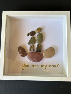 some rocks are in a white frame with the words you are my rock