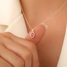 Introducing our stunning Oval Cut Ruby Necklace, the perfect embodiment of elegance and luxury. Crafted from 14K solid gold, this exquisite July birthstone pendant features a vibrant oval-cut ruby, renowned for its deep red color and stunning clarity. Accented beautifully with sparkling diamond details, this necklace is not just a piece of jewelry -- it's a meaningful gift for her, making it an ideal Christmas present for that special someone in your life. Whether it's for a birthday, anniversar Meaningful Gifts For Her, Ruby Birthstone, Sparkling Diamond, Ruby Necklace, Deep Red Color, Birthstone Pendant, Ruby Jewelry, July Birthstone, Sparkle Diamonds