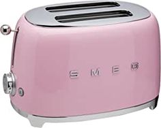 a pink toaster with the word smeg on it's front and bottom