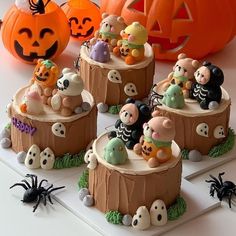 there are many halloween themed cakes on the table