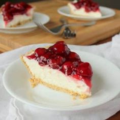 a piece of cheesecake with cherries on top