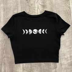 Phases Of The Moon Fitted Crop Top Crop Top Is Very Comfortable And Has High Quality Iron On Vinyl For The Design. Materials: 57% Cotton 38% Recycled Polyester 5% Spandex Care Instructions: Flip Inside Out Then You Can Machine Wash And Lay Flat To Dry Or Use Low Heat In Dryer. Cheap Edgy White Crop Top, Cheap Fitted Grunge Tank Top, Cheap Edgy Crop Top For Spring, Cute Cropped T-shirt, Cheap Gray Stretchy Crop Top, Crop Tops Colorful, Cute Cropped Tops, Fitted Moon Print Tops For Summer, Fitted Black Tops With Moon Print