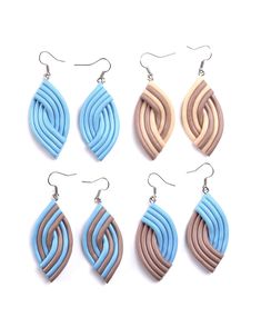 six pairs of earrings with different colors and shapes on each earring, one is blue, the other has brown