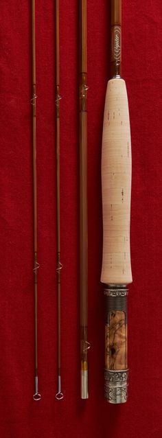 some fishing rods and poles on a red background