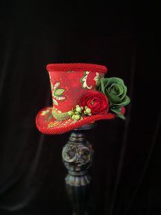 This Christmas Mini Top Hat will add that special touch to your mannequin or shop display! Or try it on as a fascinator! Decked out in coordinating silk flowers and berries this little gem will welcome in the most wonderful time of the year! This beauty measures approximately 4 1/2 inches tall 7 inches wide x 6 3/4 inches deep. If you would like elastic attached please measure your head from crown under nape of neck and back to crown. Also please specify black or white elastic in comments. Christmas Headpiece, Mad Hatter Party, Victorian Hats, Green Fur, Holiday Hats, Mini Top Hat, Top Hats, Mini Top, Christmas Tops