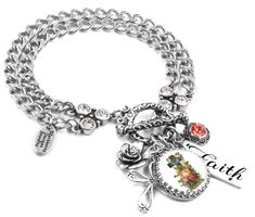 Show your Christian Faith with this Cross Bracelet created from a vintage post card of the early 1900's. The cross is surrounded by pretty roses, swarovski crystals, charms of a cross and rose and a engraved charm with Faith. Artist crafted in America of Timeless Stainless Steel, guaranteed not to tarnish. How it's made matters as much as the materials we use. Stainless Steel, Non Tarnish Romantic pendant of vintage cross with roses Sparkling crystals in moonlight and rose peach Charms of cross Mexican Bracelets With A Cross Charmhandmade, Cross With Roses, Fairytale Bracelet, Silver Cross Bracelet, Faith Bracelet, Jewelry Cross, Christian Bracelets, Rose Peach, Faith Jewelry