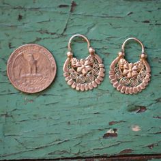 Gorgeous, handmade silver Jerez arracada earrings from central Mexico. These are relatively light weight and the designs are from the state of Zacatecas, Mexico. The arracada shape is a traditional Mexican earring crescent shape. The design is a typical floral and filagree center with scalloped edges. Arracada earrings do not sit perpendicular to the head. They sit at a slight angle and sometimes you can see the back of the earring as you face a mirror. They are supposed to be that way! state of Mexican Earrings, Crescent Shape, Traditional Mexican, A Typical, Scalloped Edges, Scalloped Edge, Handmade Silver, That Way, Crescent