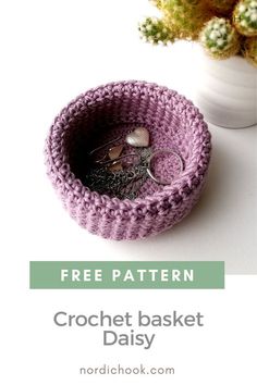 a crochet basket is sitting next to a potted plant with the text free pattern