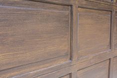 a close up view of a wooden garage door