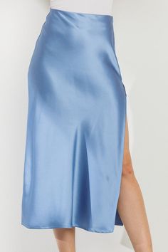 Experience the ultimate comfort and elegance with our Time Slipped Away Satin Midi Skirt in Blue! Featuring a soft, blue color and a flowy design, this slip skirt is perfect for any occasion. Made with luxurious satin material, it's the perfect addition to your wardrobe. Let time slip away in style!Styling Tip: Pair it with a graphic Tee and wide brim hat for an easy day look or dress it up with a spicy top for date night! Material Content: 98% Polyester 2% Spandex Luxury Elegant Blue Bottoms, Luxury Blue Skirt Bottoms, Luxury Blue Tops For Night Out, Luxury Blue Satin Dress For Night Out, Luxury Blue Flowy Midi Dress, Luxury Blue Midi Skirt, Flowy Design, Easy Day, Satin Midi Skirt