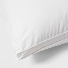 a white pillow on a white surface