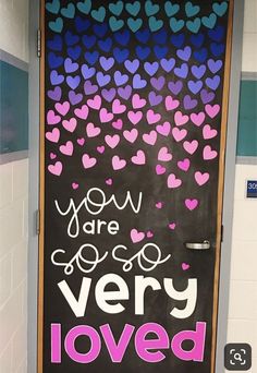 a door decorated with hearts and the words you are very loved