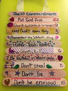 the ten commandments for god's love are hanging on a green wall in front of a door