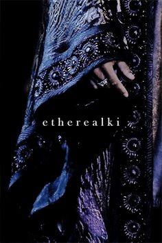 the cover of etheraki's album, with an image of a woman in blue