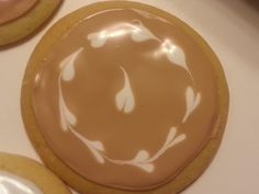 some cookies with icing on them sitting on a table