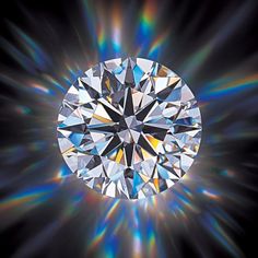 an image of a diamond surrounded by rays