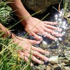 someone is washing their hands in the water with soapy bubbles on it's fingers